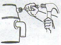 removing the knockout plug on a disposal's dishwasher drain port